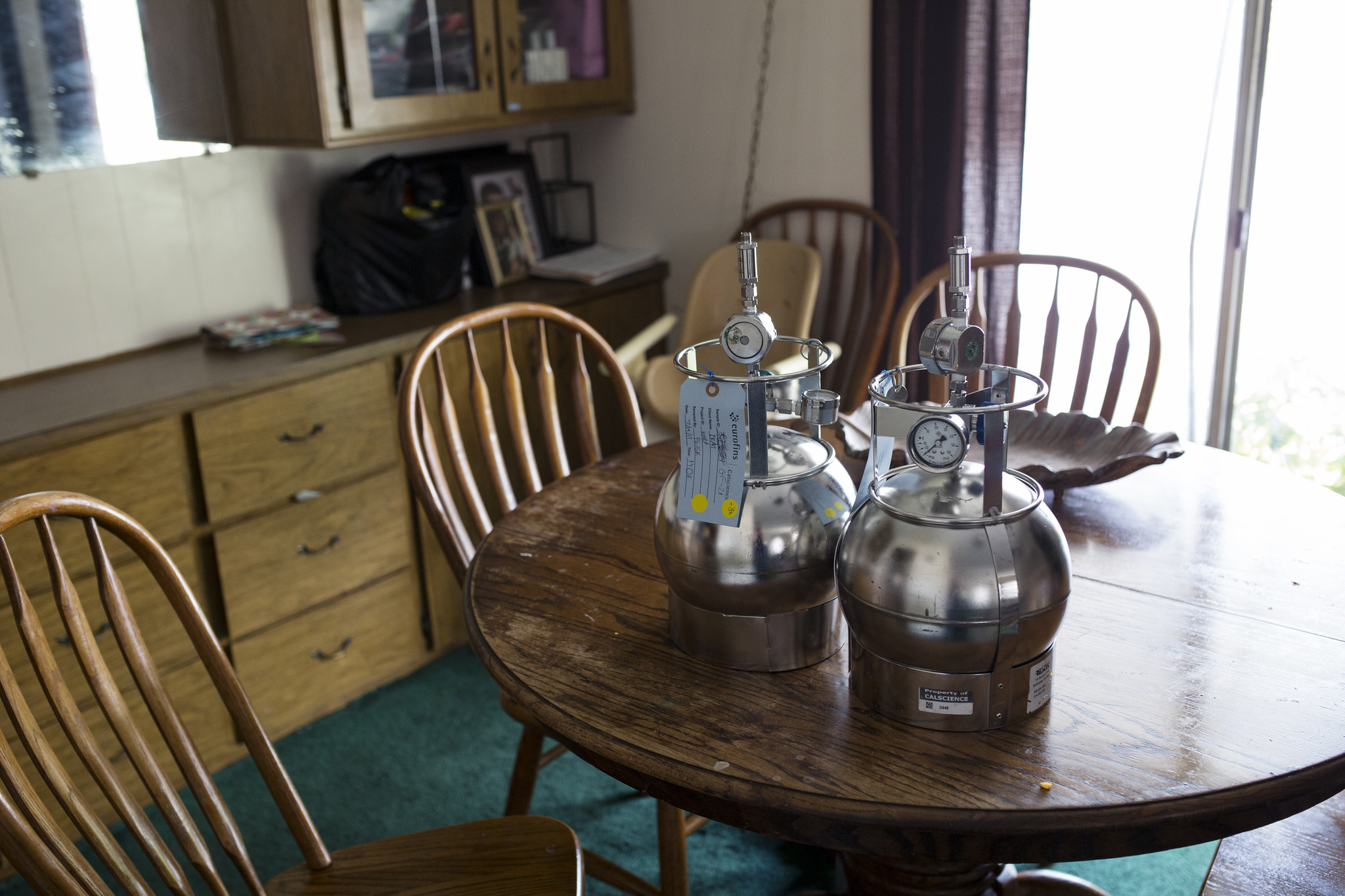 Equipment for measuring indoor air pollution sits on the dining table of a family in El Cajon. Harmful levels of a solvent were found here in two earlier rounds of tests. July 18, 2017. Megan Wood/inewsource