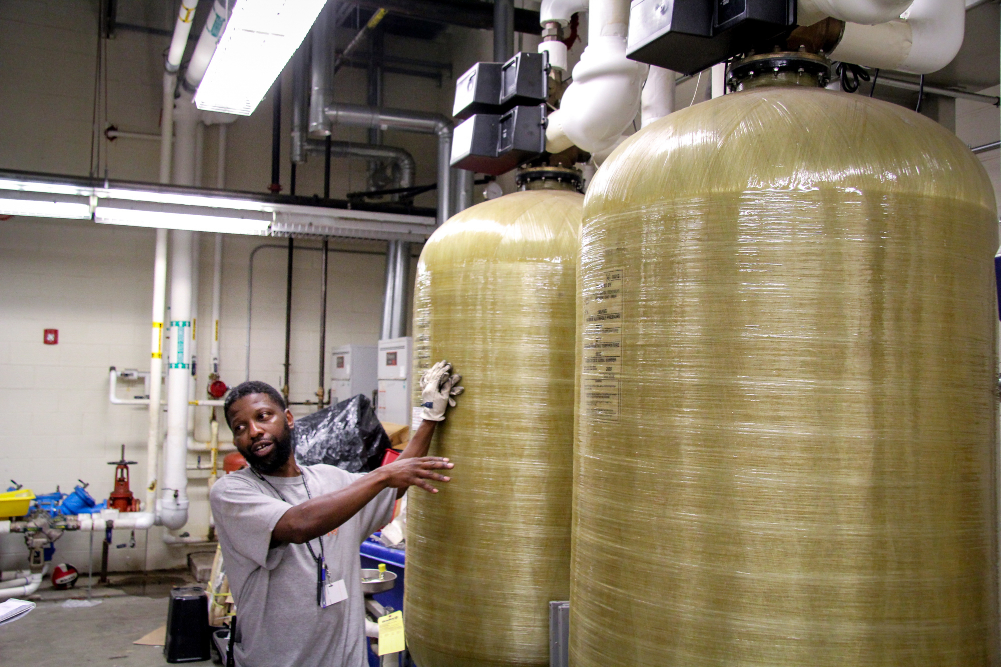 Custodian Jason Ferguson monitors the levels of lead in the water at Thomas H. Dudley Family School in Camden, N.J. Fraser Allan Best, News21